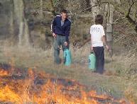 The image of botany members are distorted behind the smoke